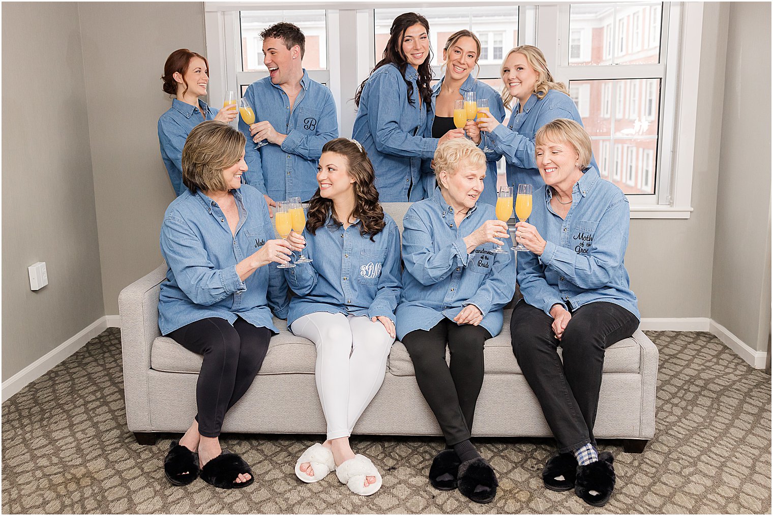 bride has mimosas with bridesmaids and mother