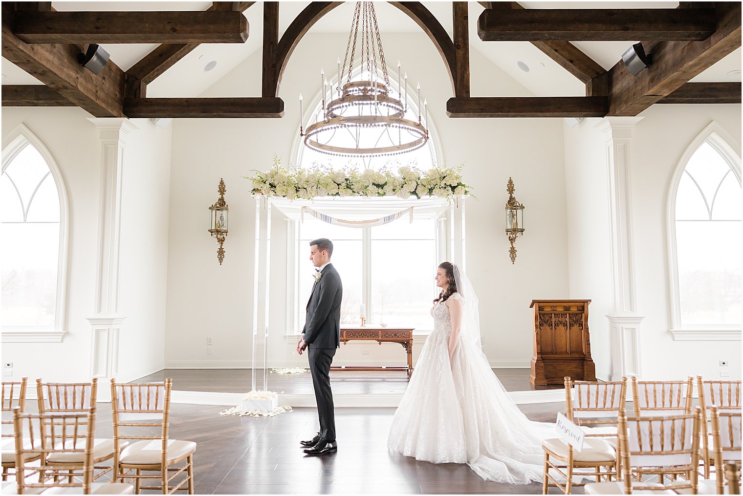 bride approaches groom for first look in chapel at Park Savoy Estate