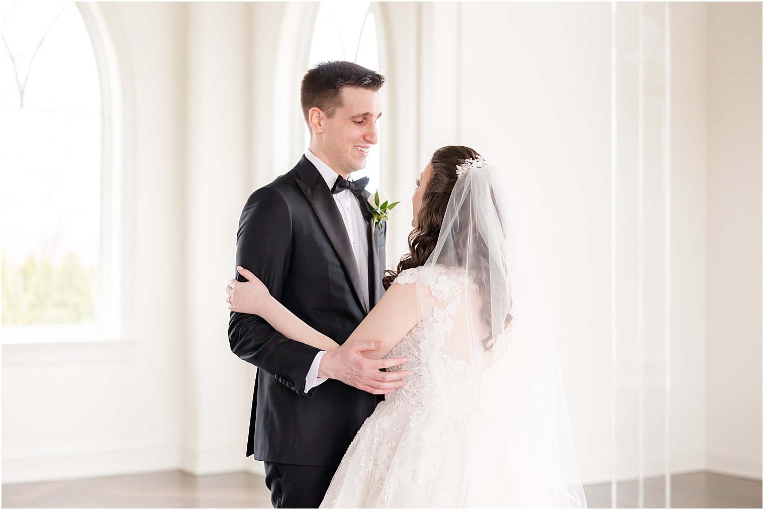 bride and groom hug in chapel at Park Savoy Estate