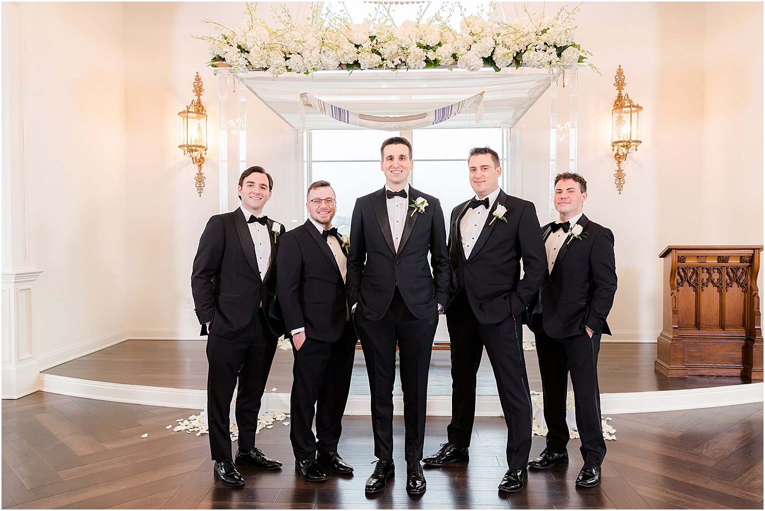 groomsman stand with hands in pocket by chuppah in chapel at Park Savoy Estate