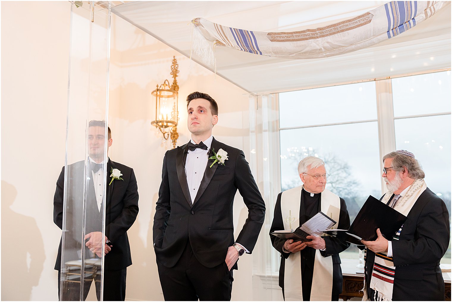 groom stands at alter waiting for bride 