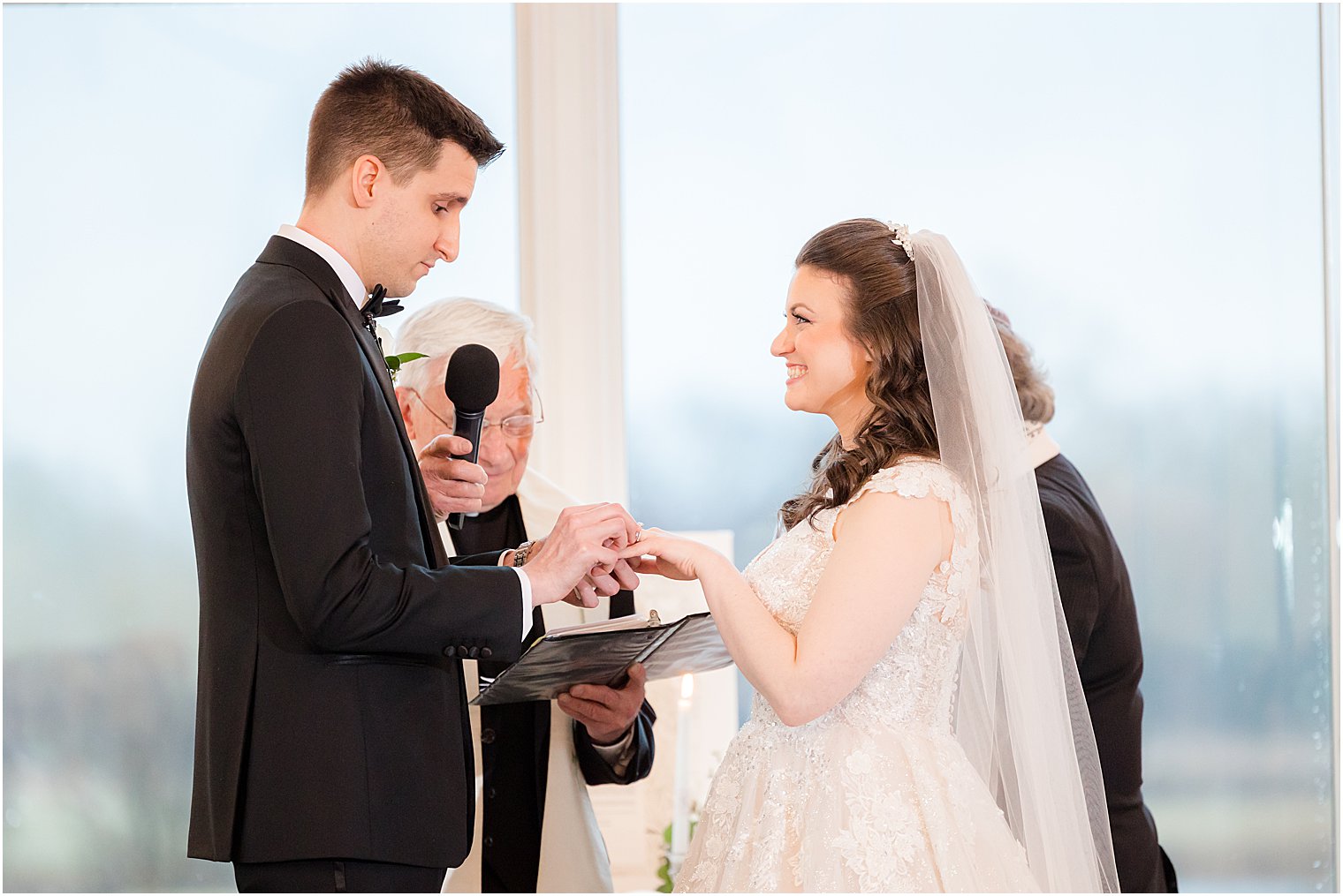 bride and groom exchange rings during chapel at Park Savoy Estate