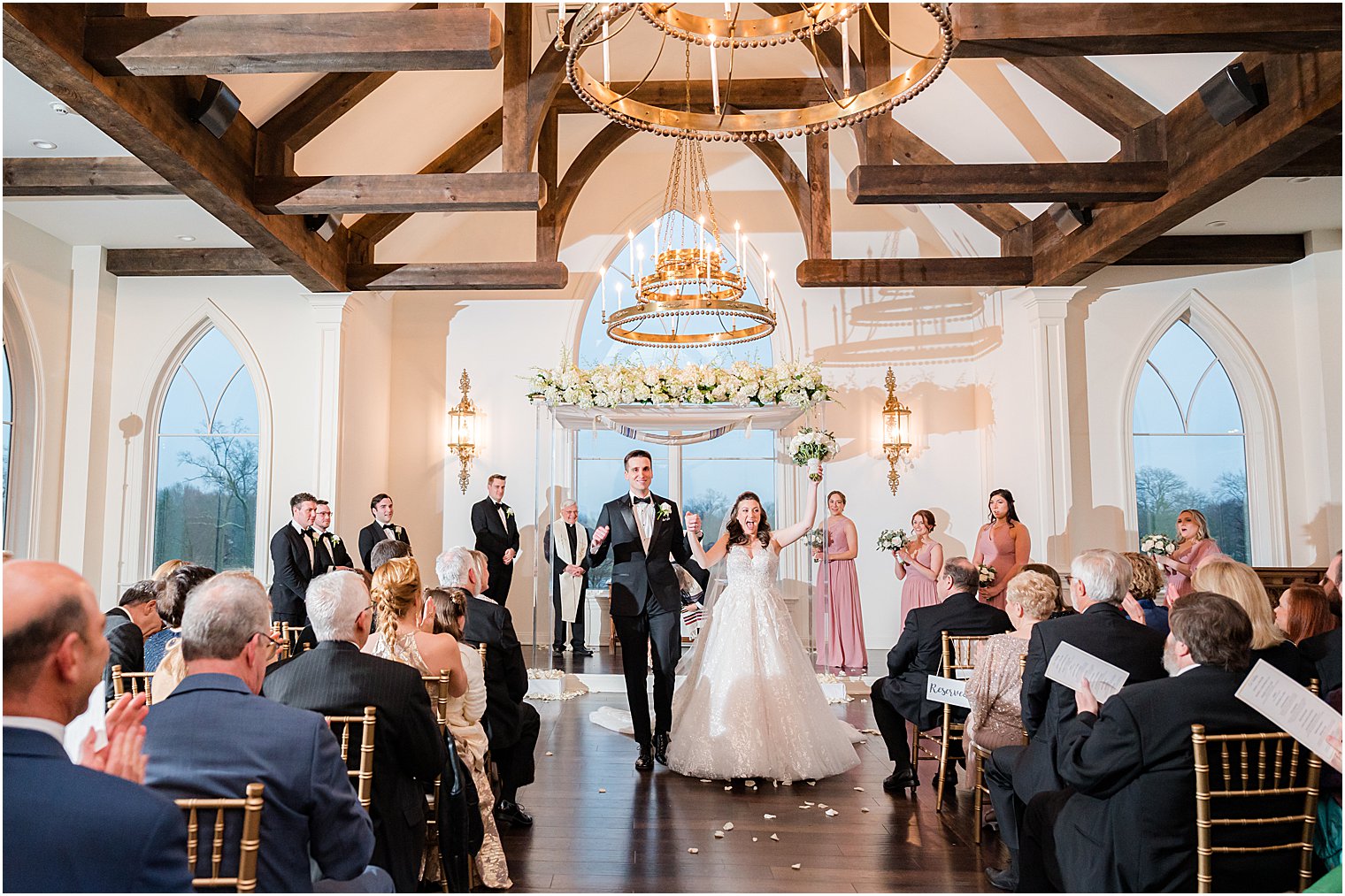 newlyweds walk up aisle after chapel at Park Savoy Estate