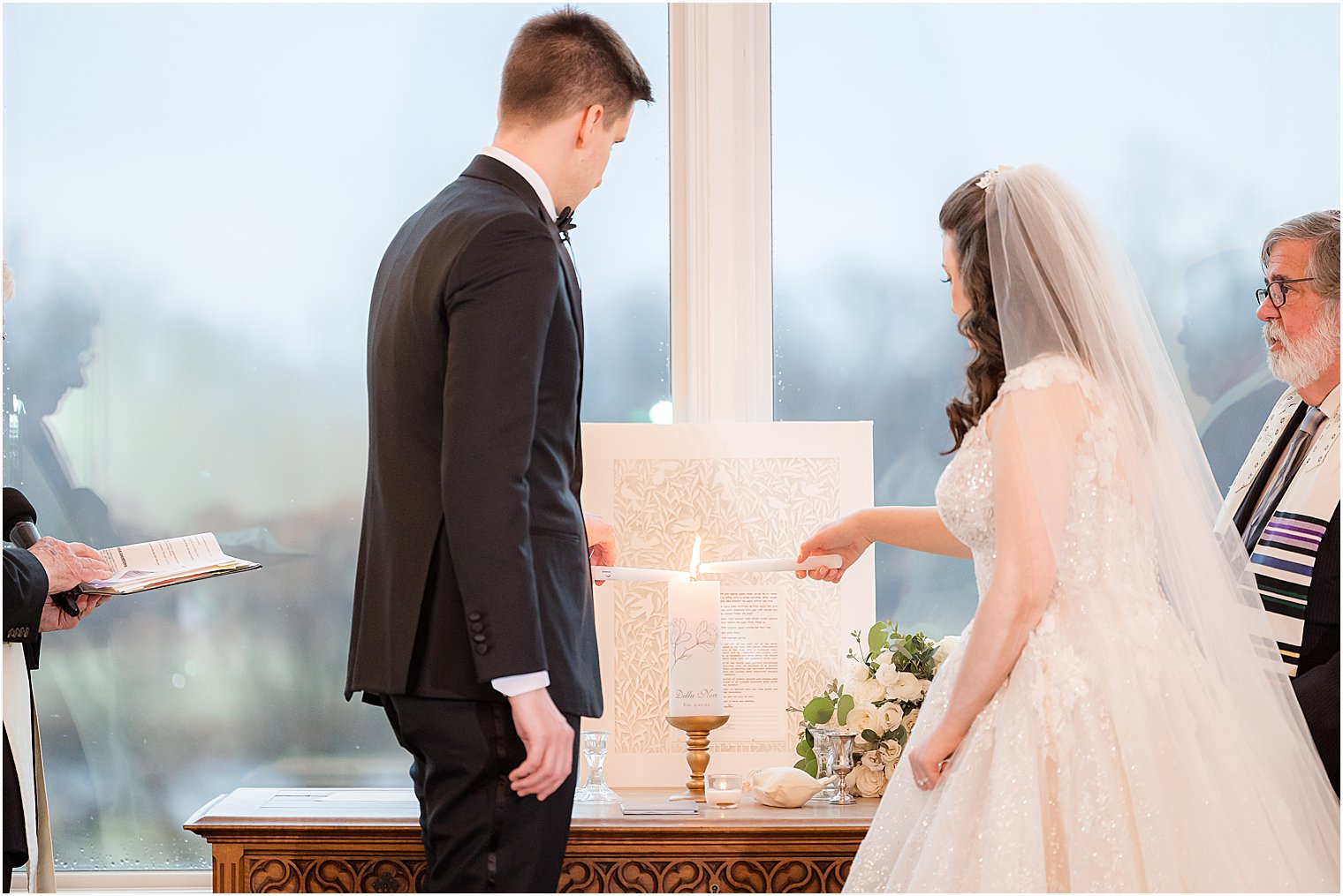 bride and groom light unity candle during chapel at Park Savoy Estate