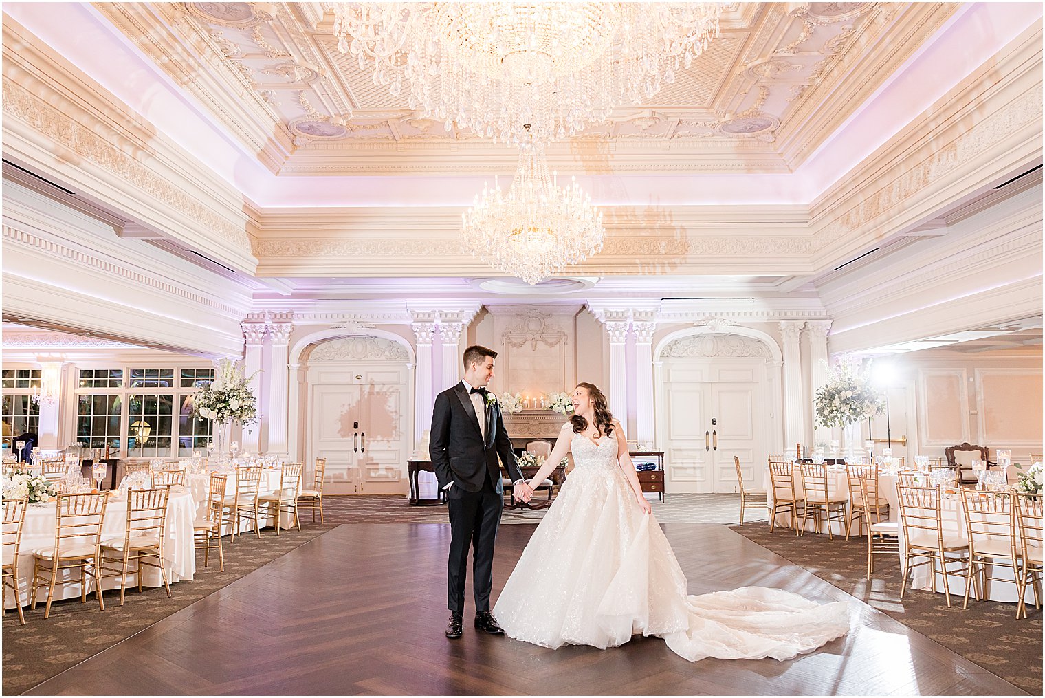 bride and groom walk on dance floor at Park Savoy Estate