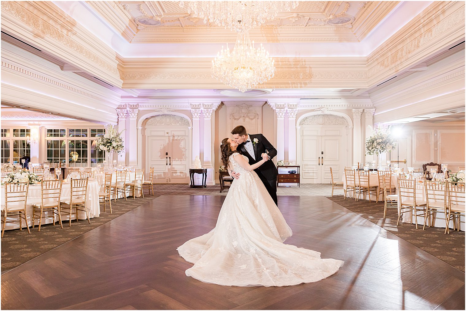 groom dips bride on dance floor at Park Savoy Estate