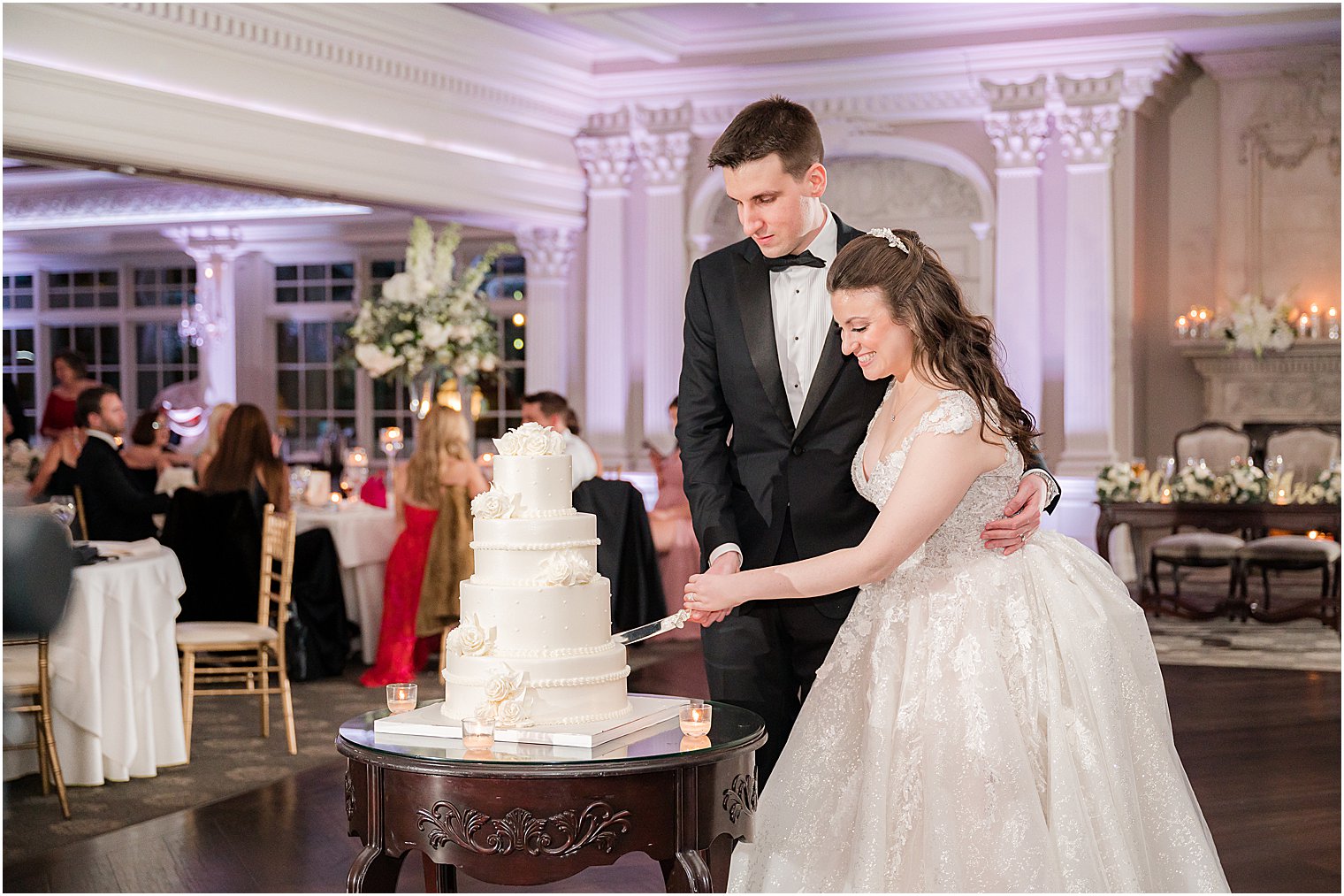 bride and groom cut wedding cake at Park Savoy Estate