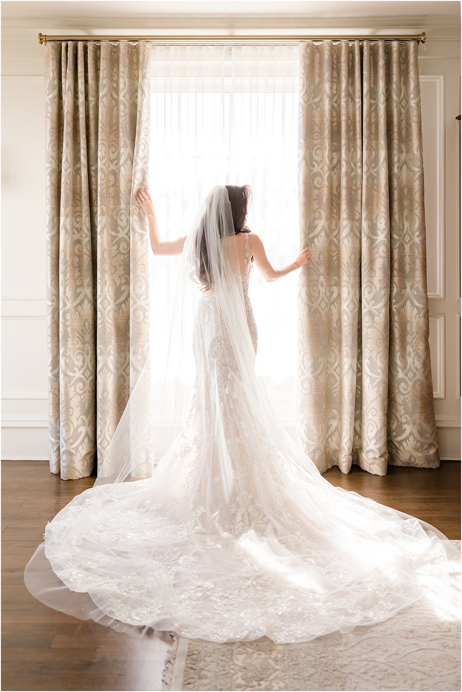 bride stands in window at Park Savoy Estate