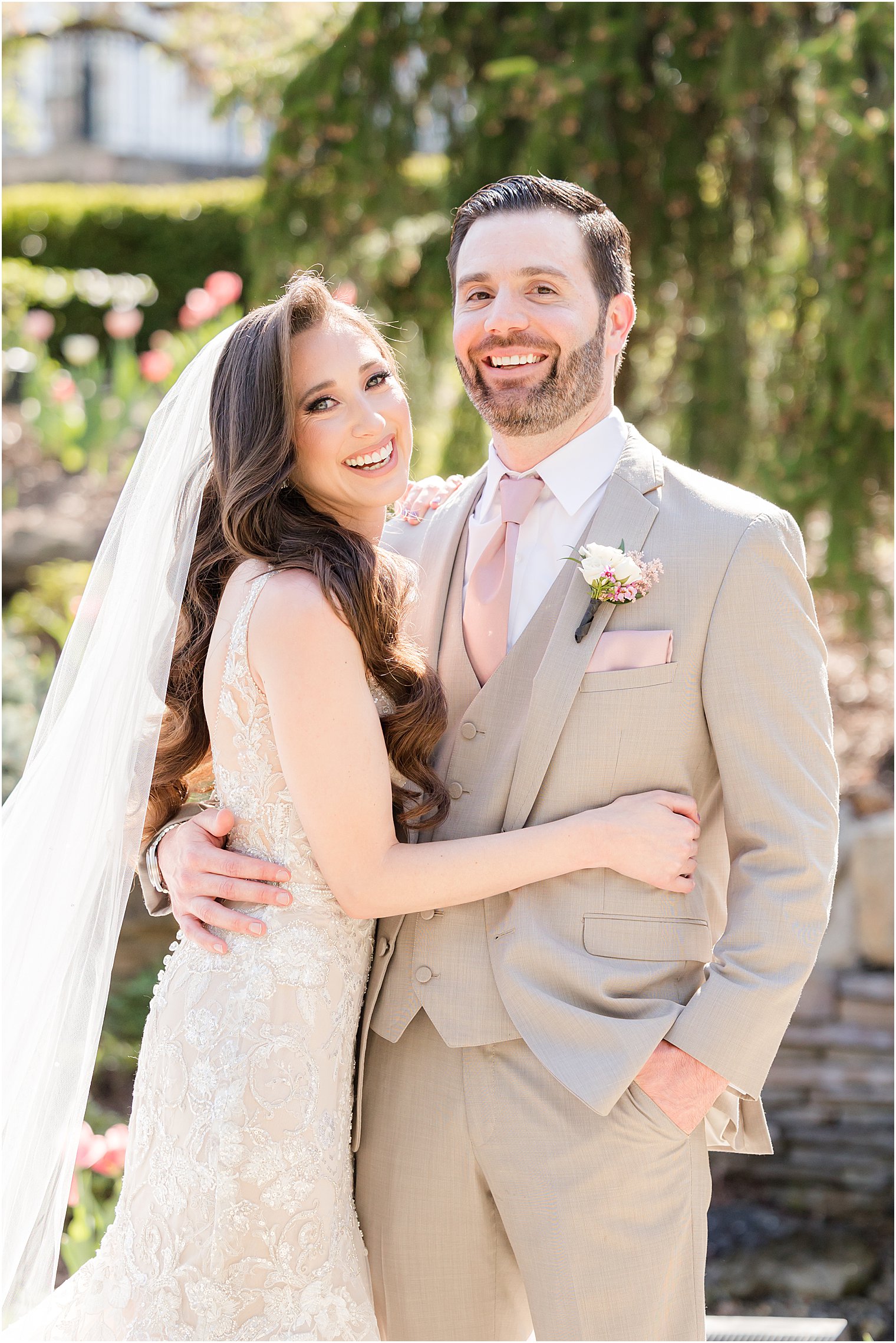 bride and groom hug in gardens at Park Savoy Estate