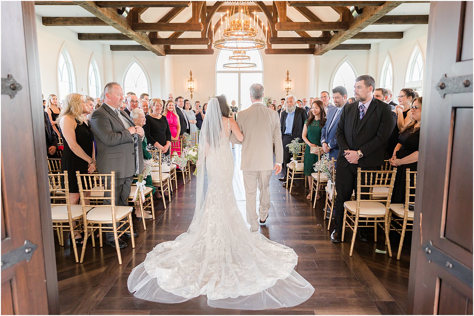 bride walks down aisle with father for ceremony in Park Savoy Estate chapel