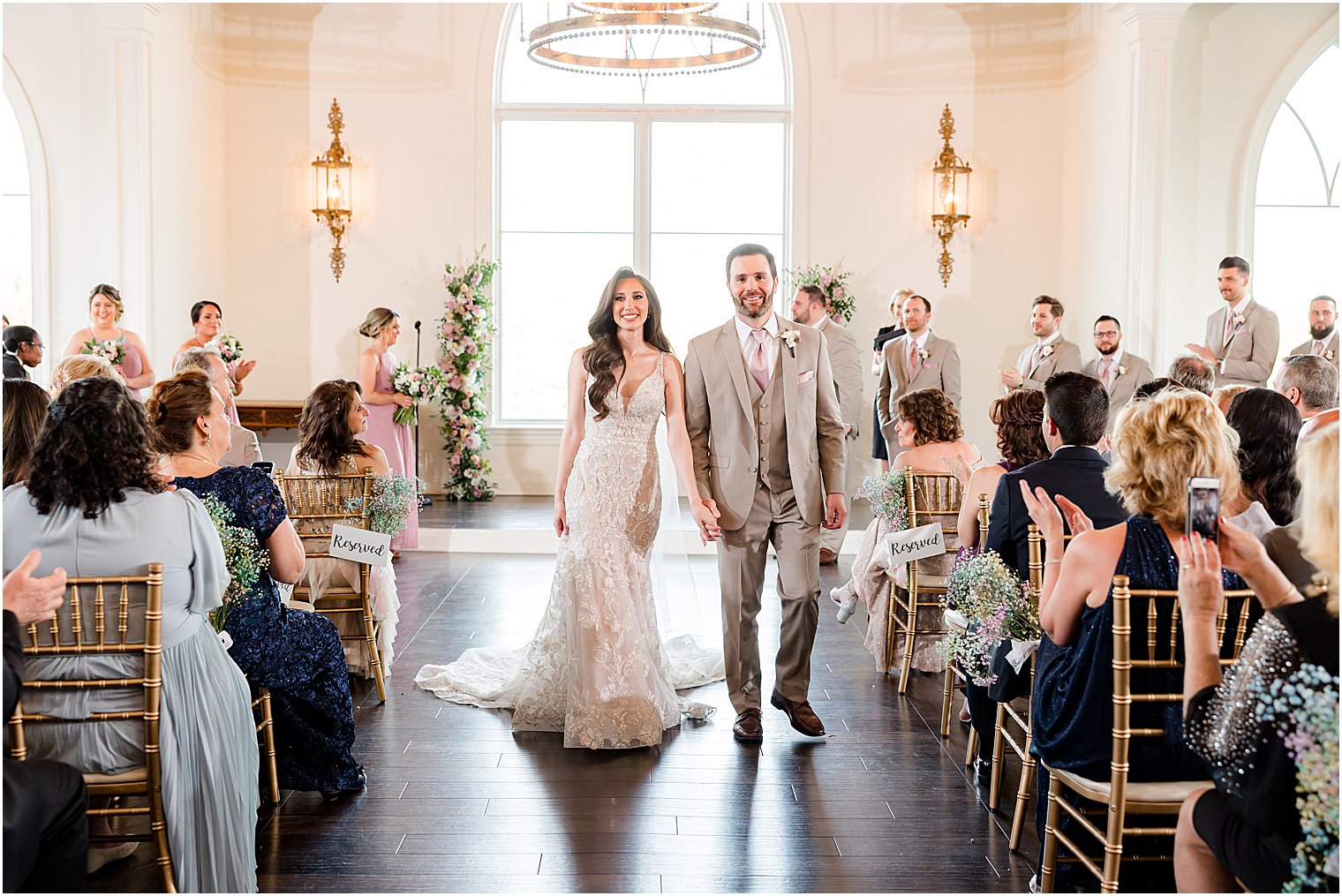 newlyweds leave wedding ceremony in Park Savoy Estate chapel