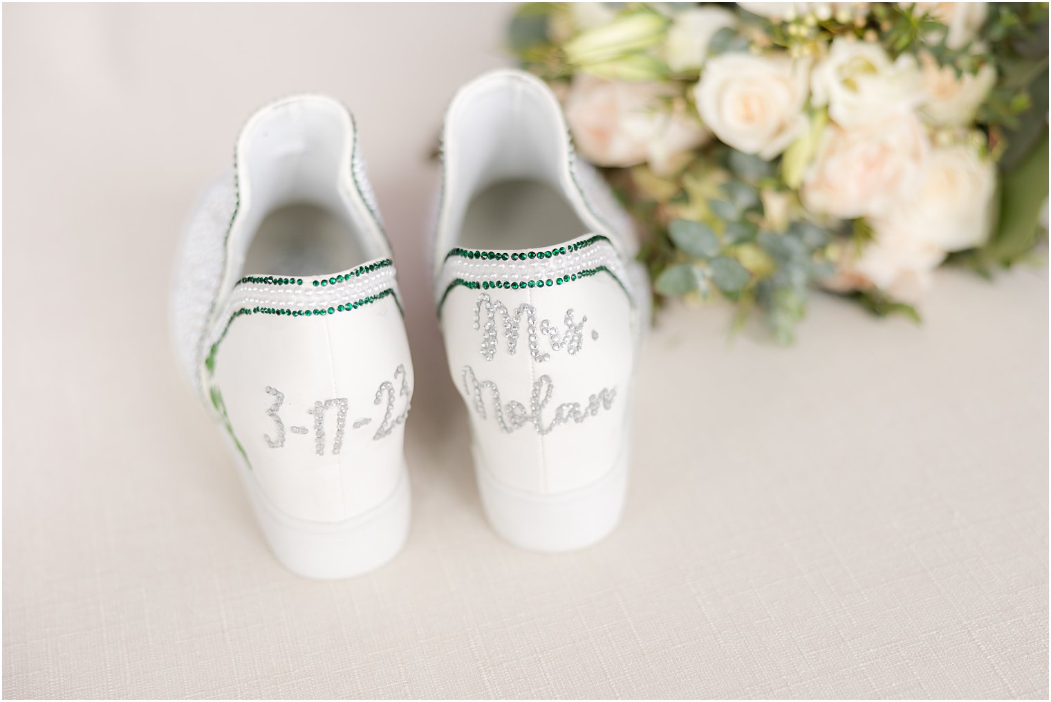 bride's custom shoes with emerald diamonds