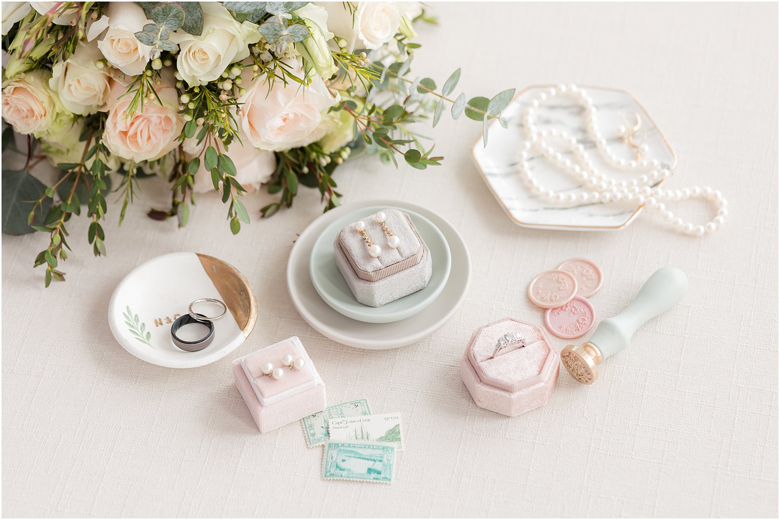 jewelry in ring box with wax seals and vintage stamps at Crystal Point Yacht Club