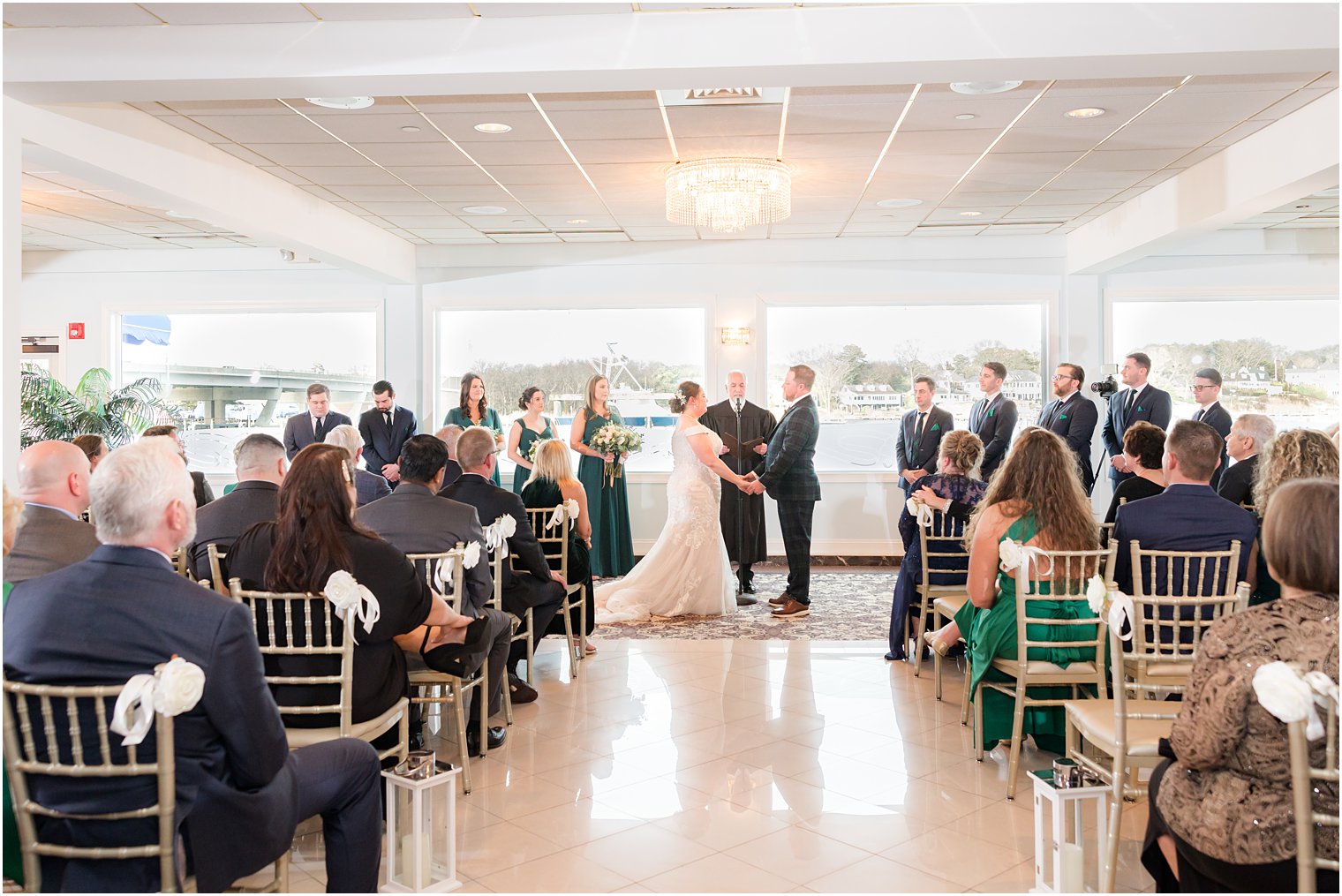 wedding ceremony with waterfront views at Crystal Point Yacht Club