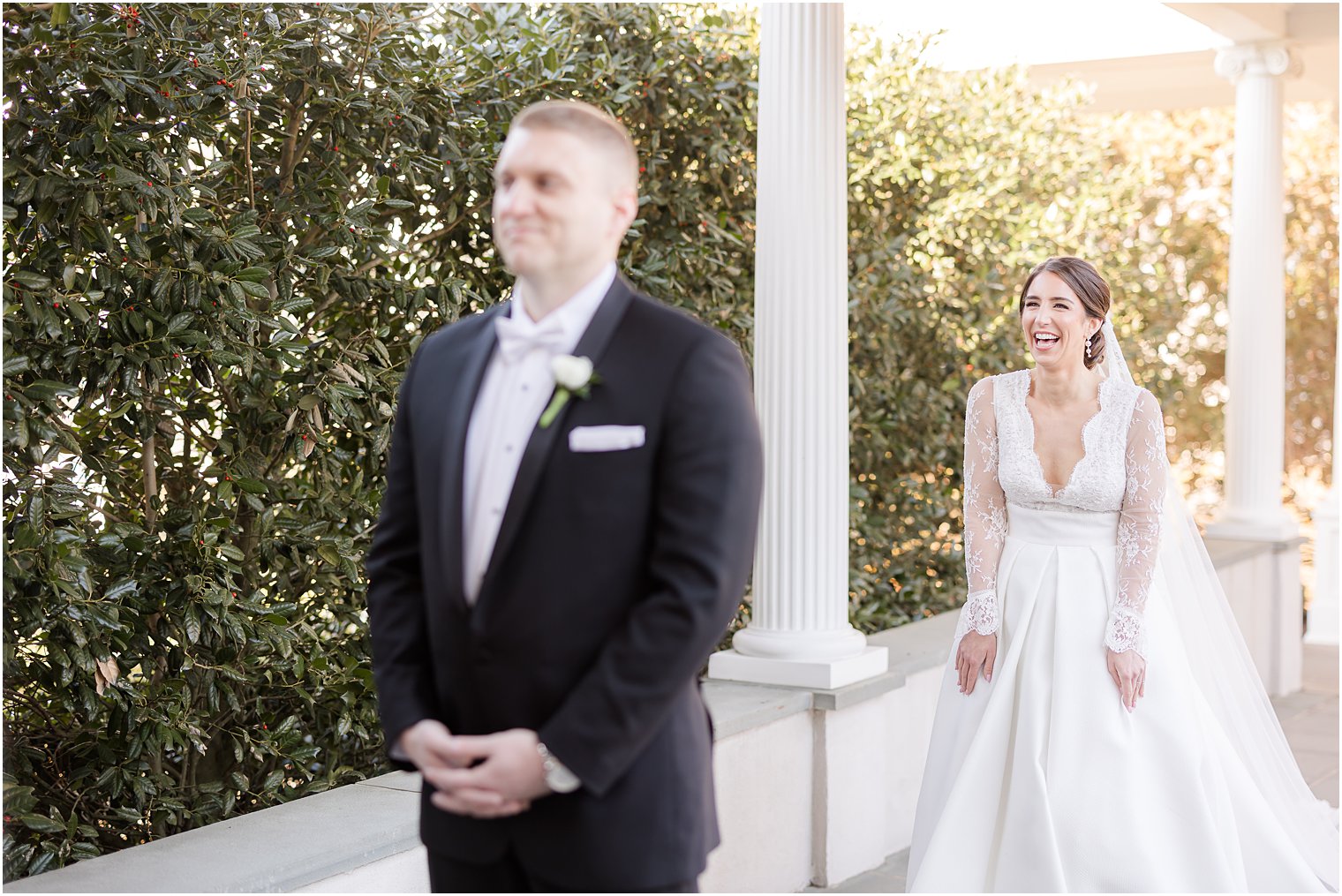 bride laughs approaching groom for first look at Park Chateau Estate