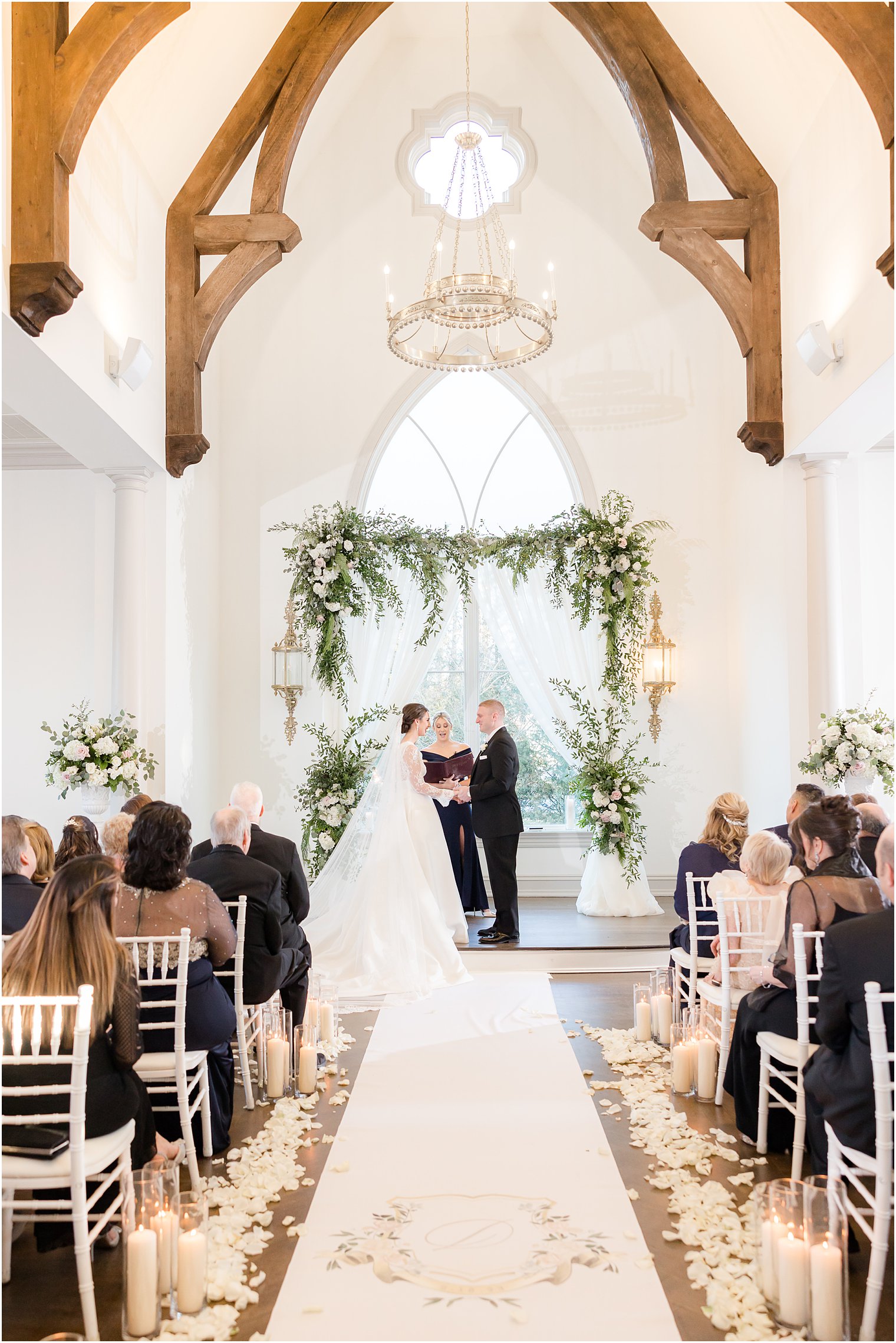bride and groom exchange vows during ceremony inside Park Chateau Estate's chapel