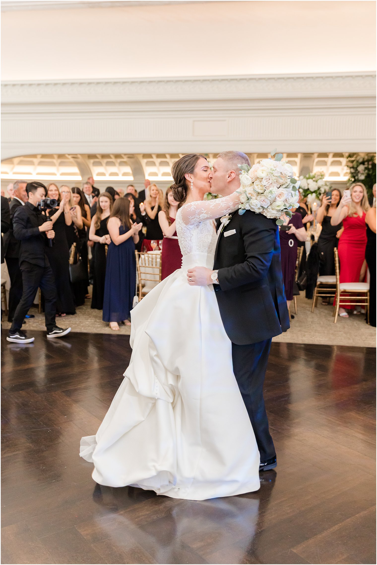 bride and groom kiss on dance floor at Park Chateau Estate