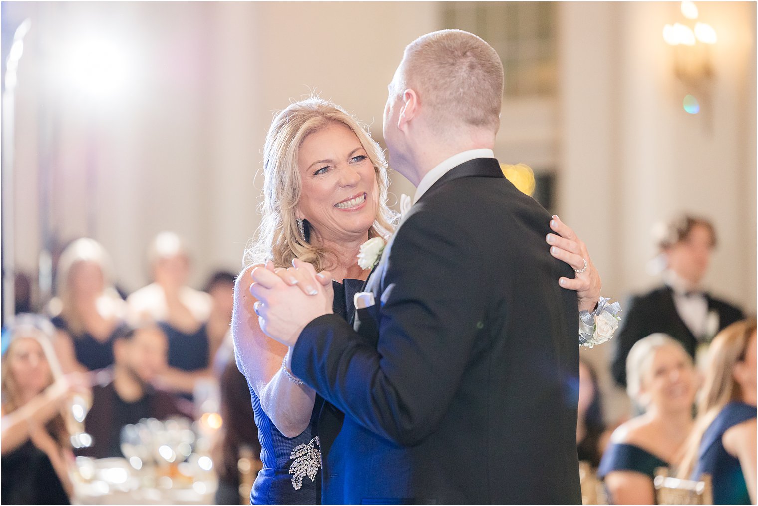 mother smiles at groom during dance at Park Chateau Estate