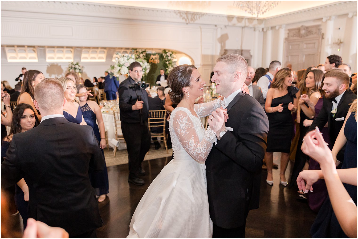 newlyweds sing and dance together during wedding reception 