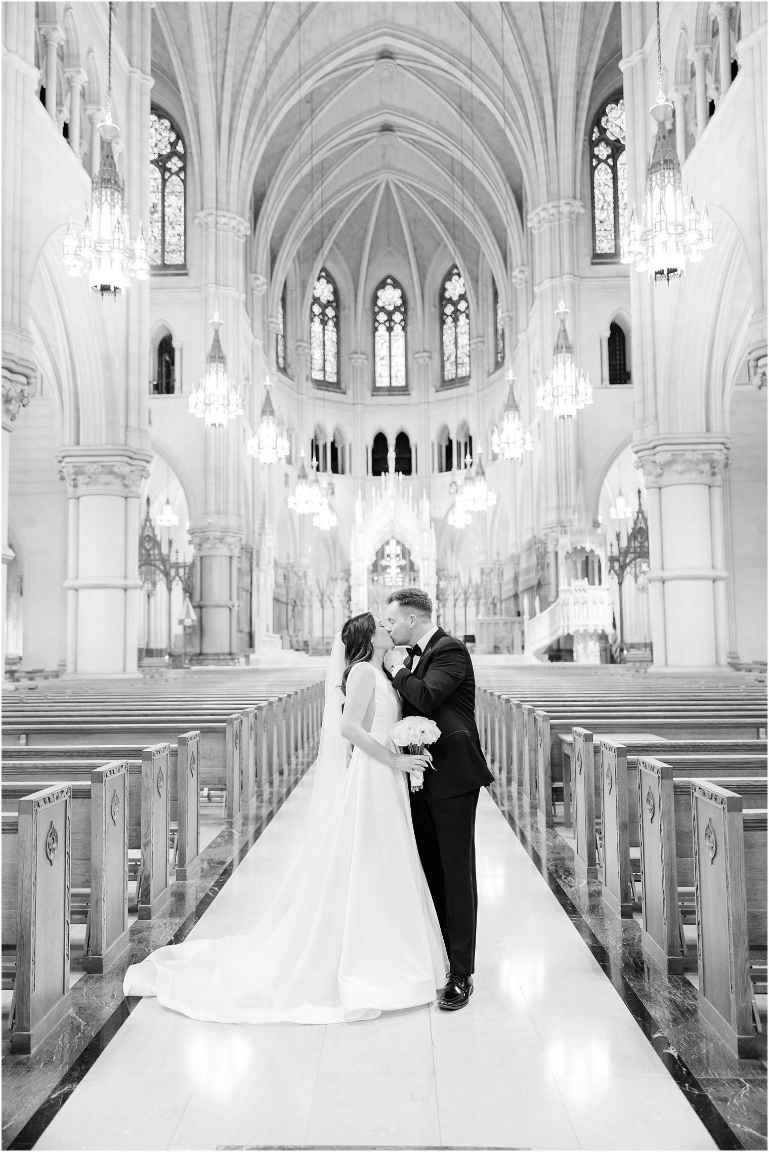 newlyweds kiss during ceremony at The Cathedral Basilica of the Sacred Heart