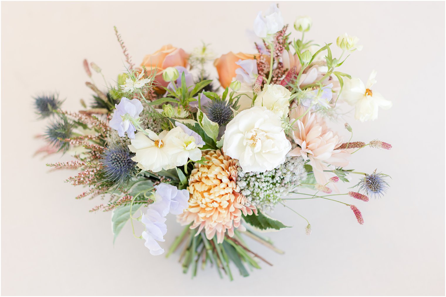 bouquet for bride of white, orange and peach flowers 