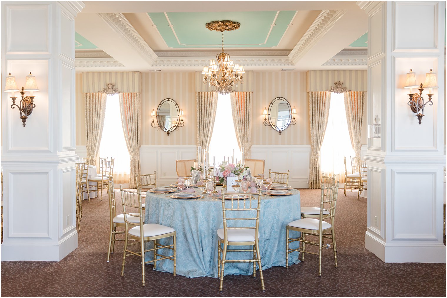 wedding reception with gold, pink, and blue details at Mallard Island Yacht Club