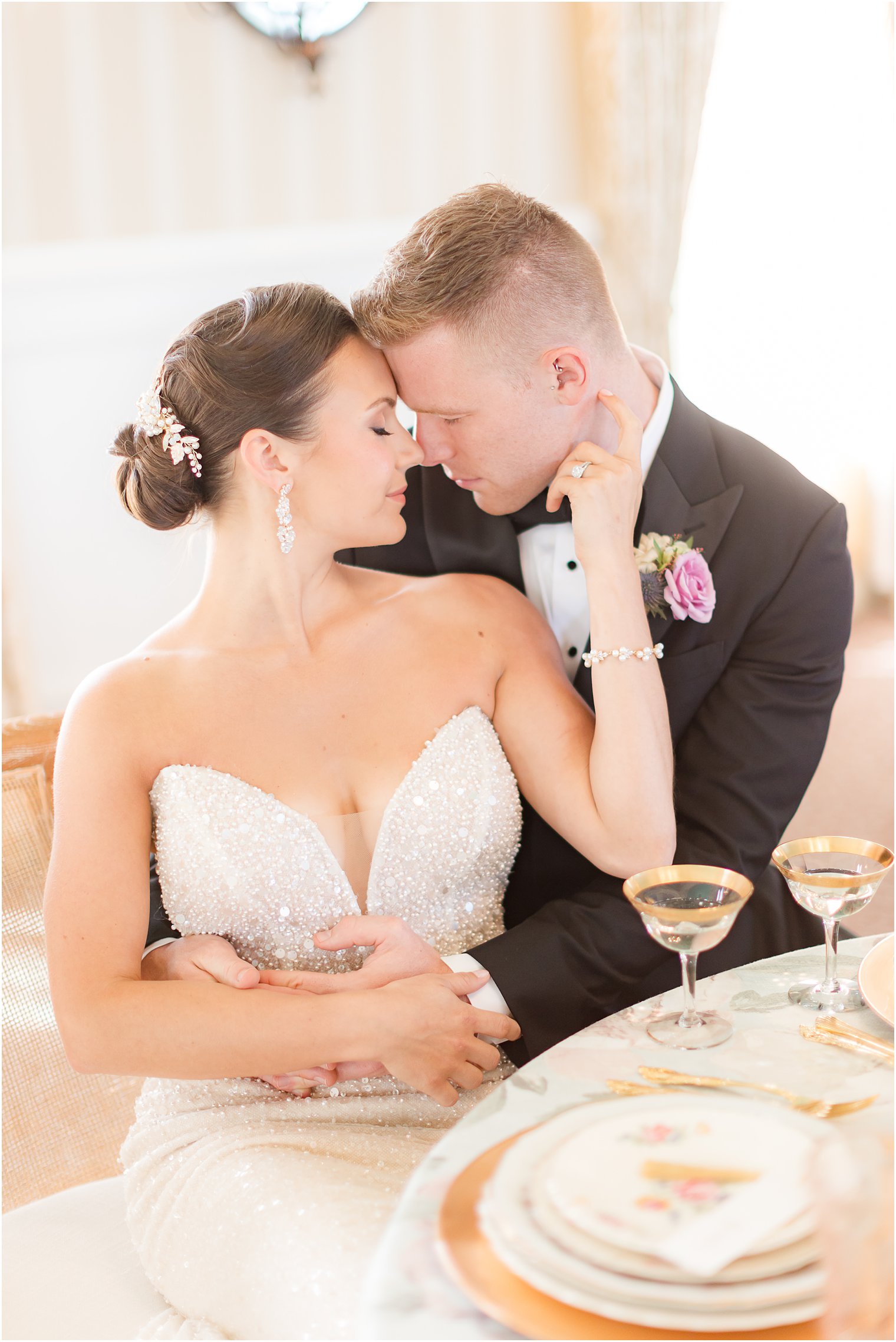 couple leans together nuzzling noses at Mallard Island Yacht Club