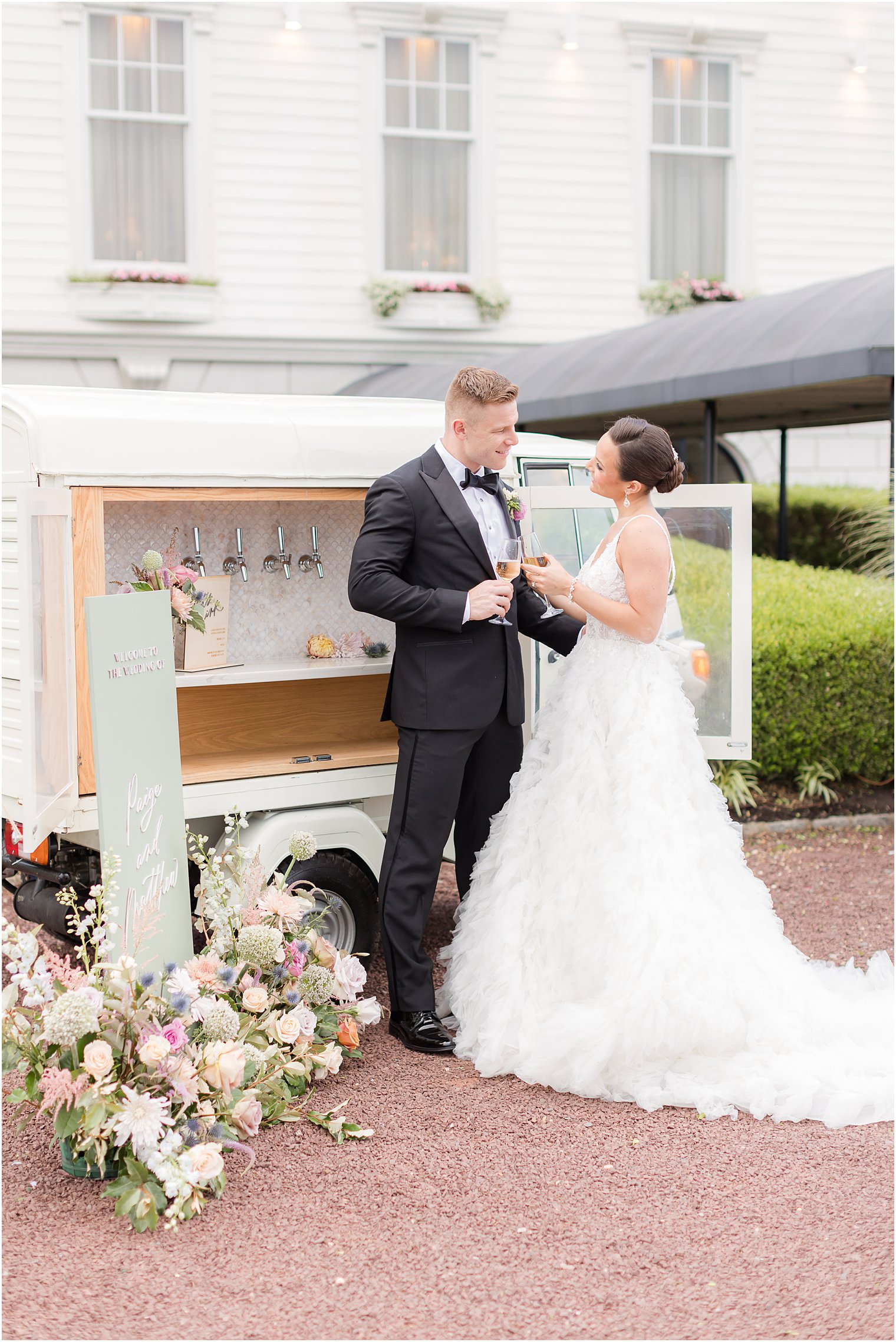 newlyweds toast drinks by mobile bar on Long Beach Island 