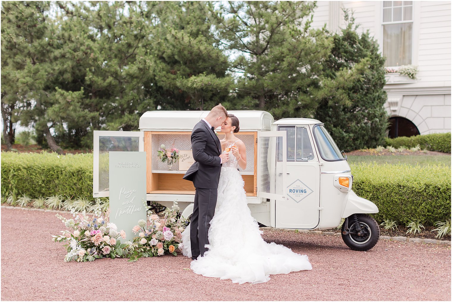 bride and groom kiss by mobile bar for LBI wedding at Mallard Island Yacht Club