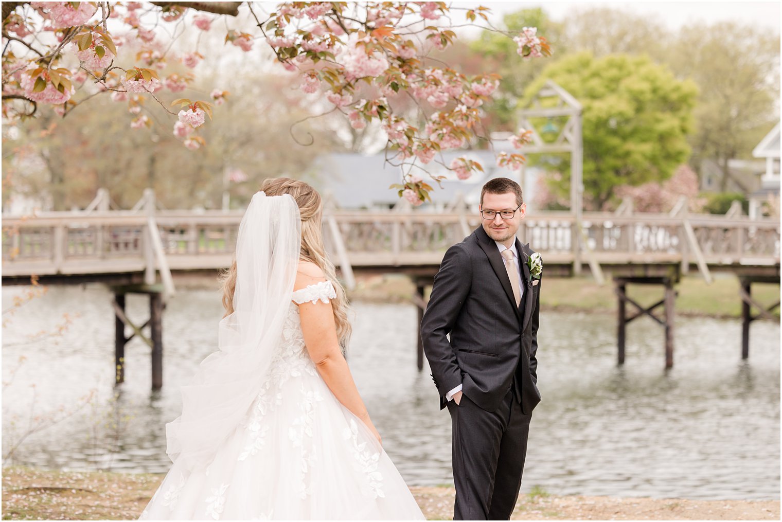 groom turns to see bride during first look at Divine Park in Spring Lake NJ