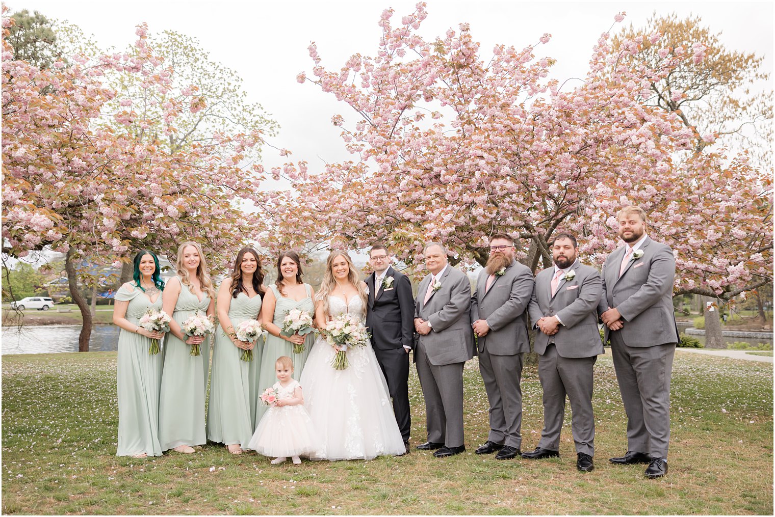 bride and groom stand together in Divine Park in Spring Lake NJ