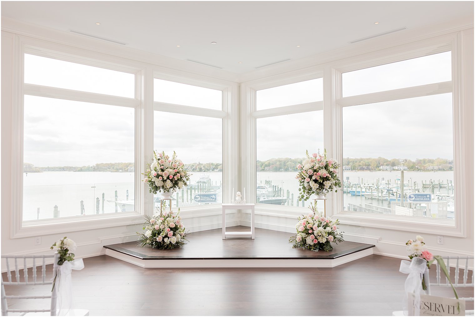 floral arrangements and unity candle for Clark's Landing Yacht Club wedding ceremony 