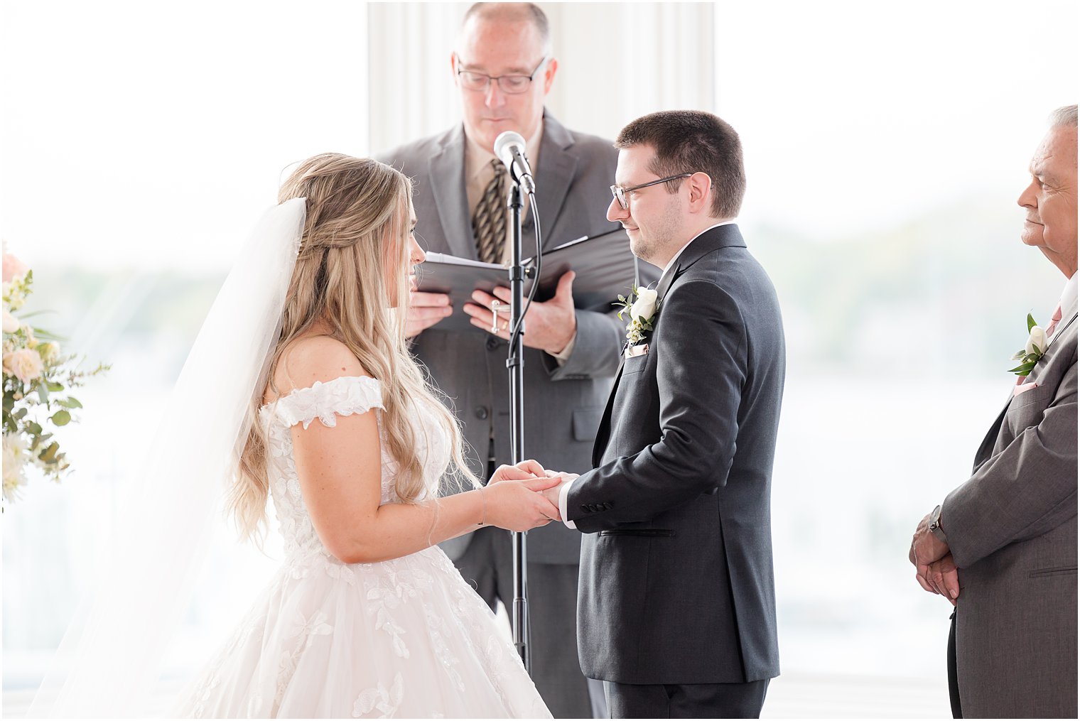 couple reads vows during Clark's Landing Yacht Club wedding ceremony