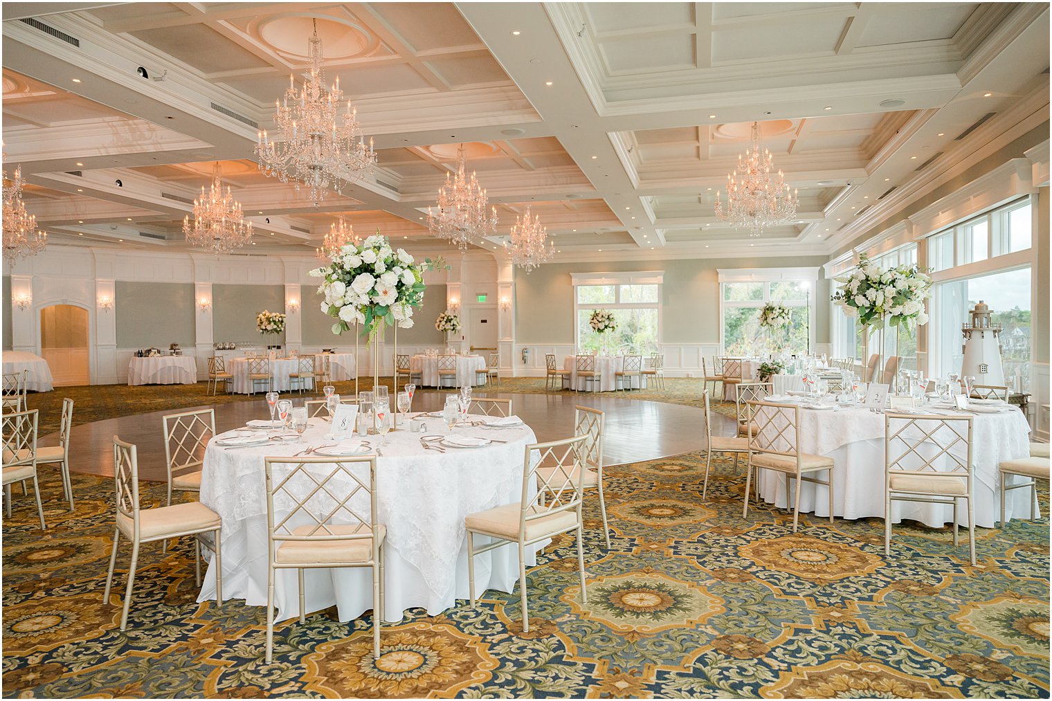 wedding reception at Clark's Landing Yacht Club with ivory florals