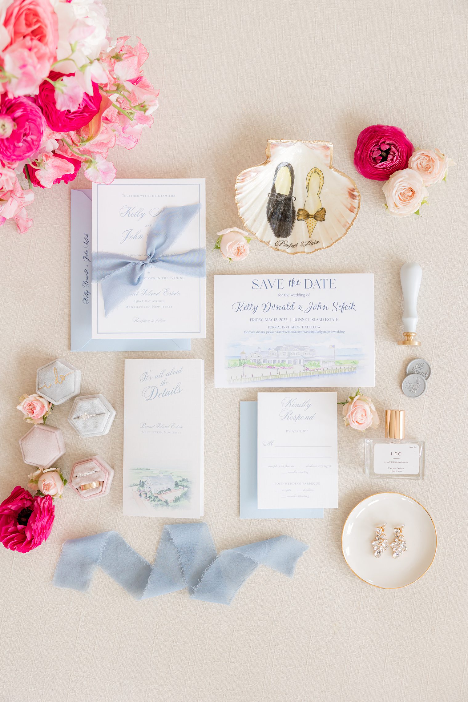 Wedding invitation details with shades of blue and pops of pink