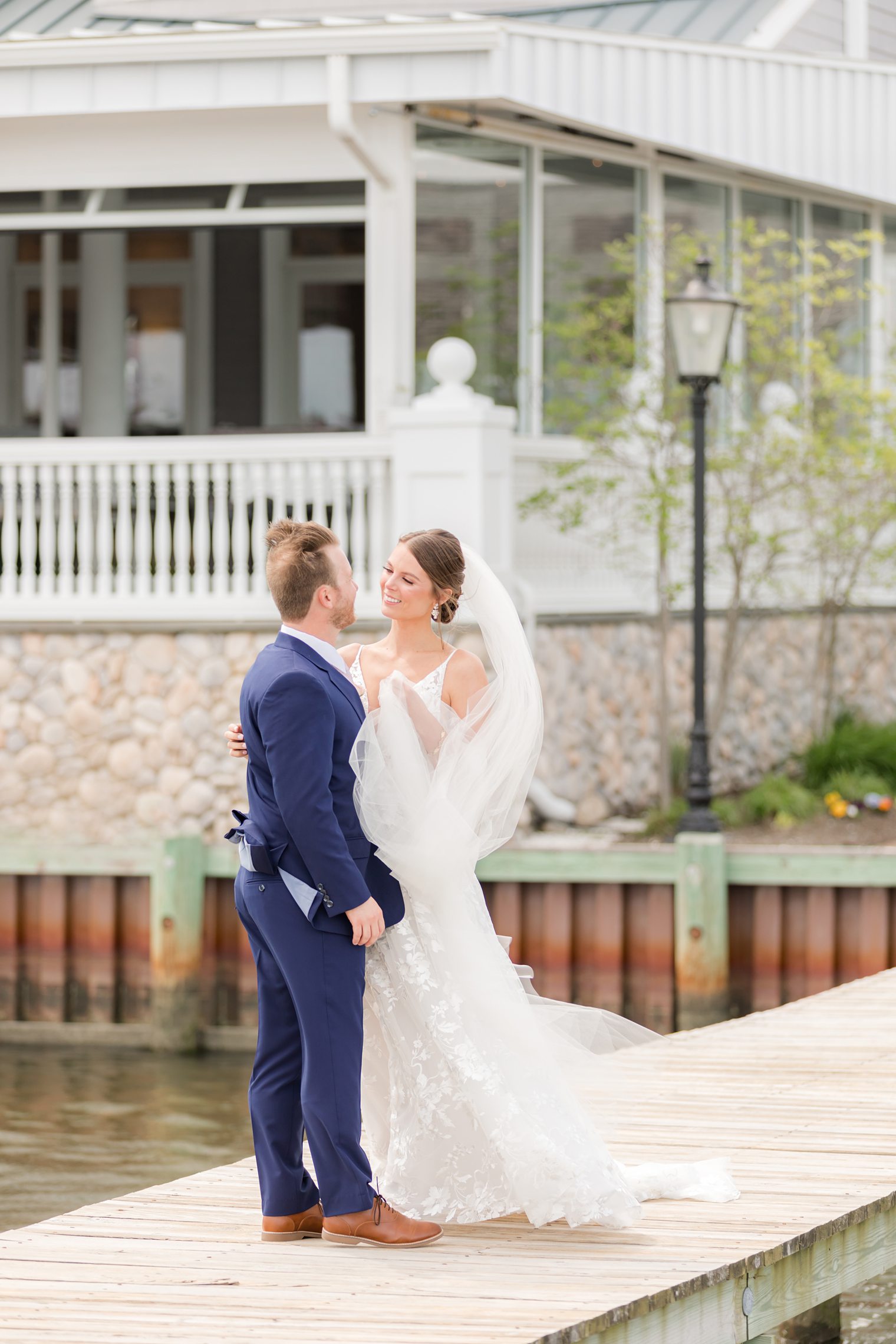 Happy bride and groom, smiling at each other