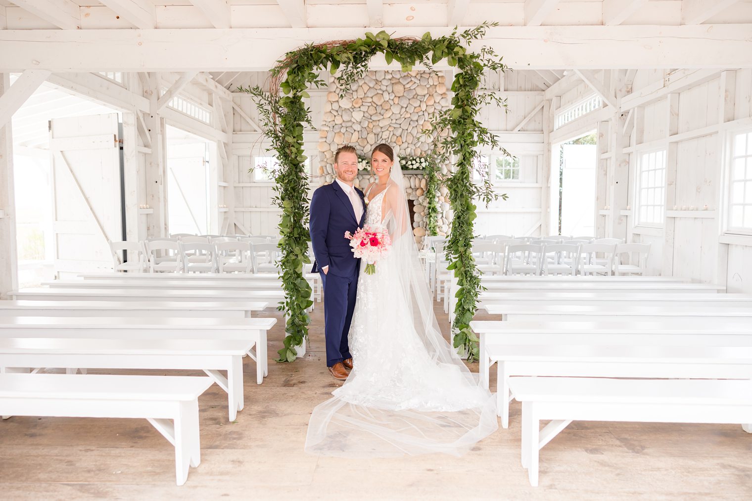 Bride and her fiance happily posing for their wedding session at Bonnet Island Estate