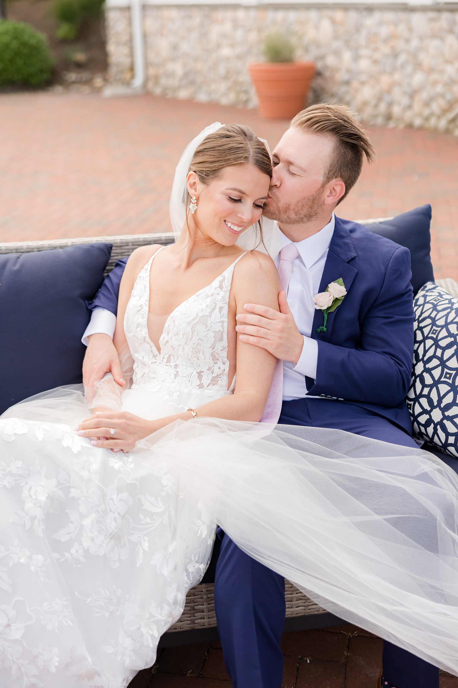 Groom kissing his bride head at Bonnet Island Estate