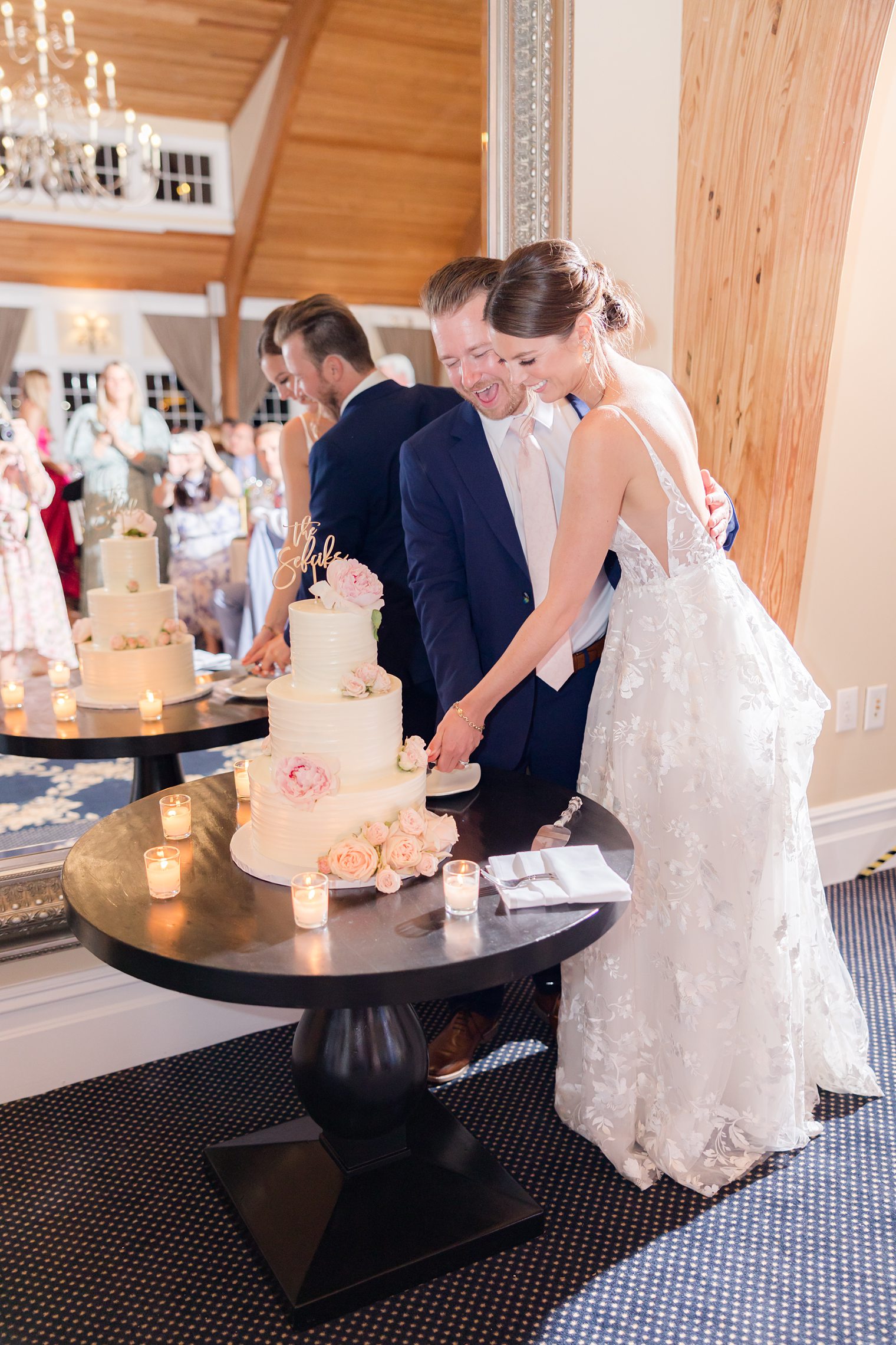 Mr and Mrs cutting their wedding cake