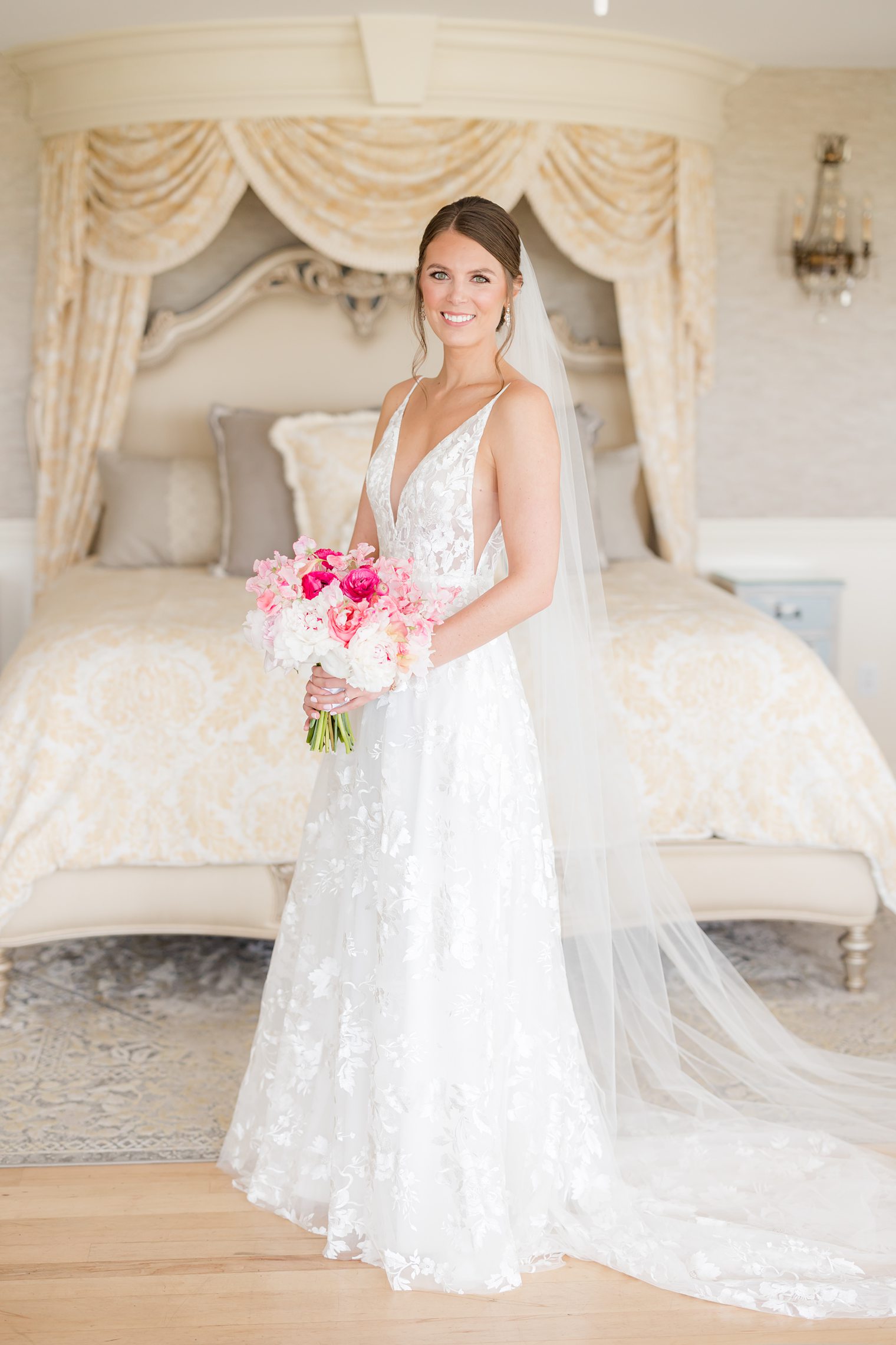 Bride ready modeling with her bouquet with pops of pink 