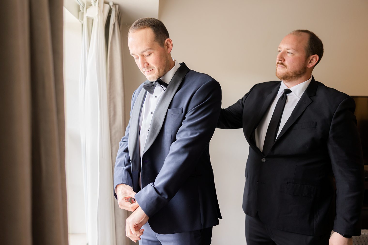 Brother of the groom helping him to get finish for the wedding at Indian Trail Club