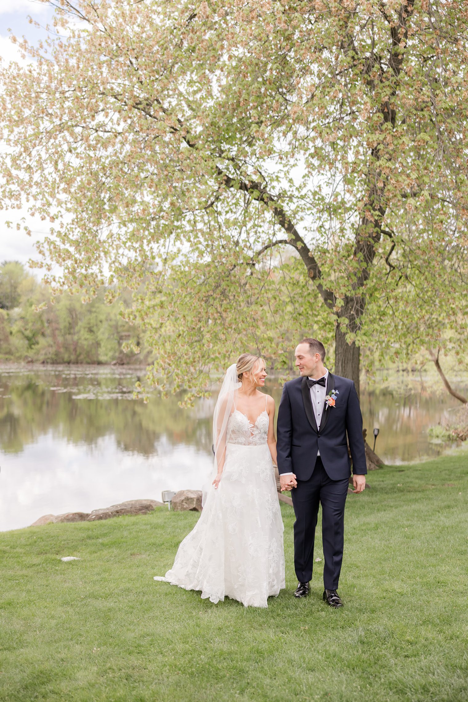 Couple holding hands and looking each other at Indian Trail Club