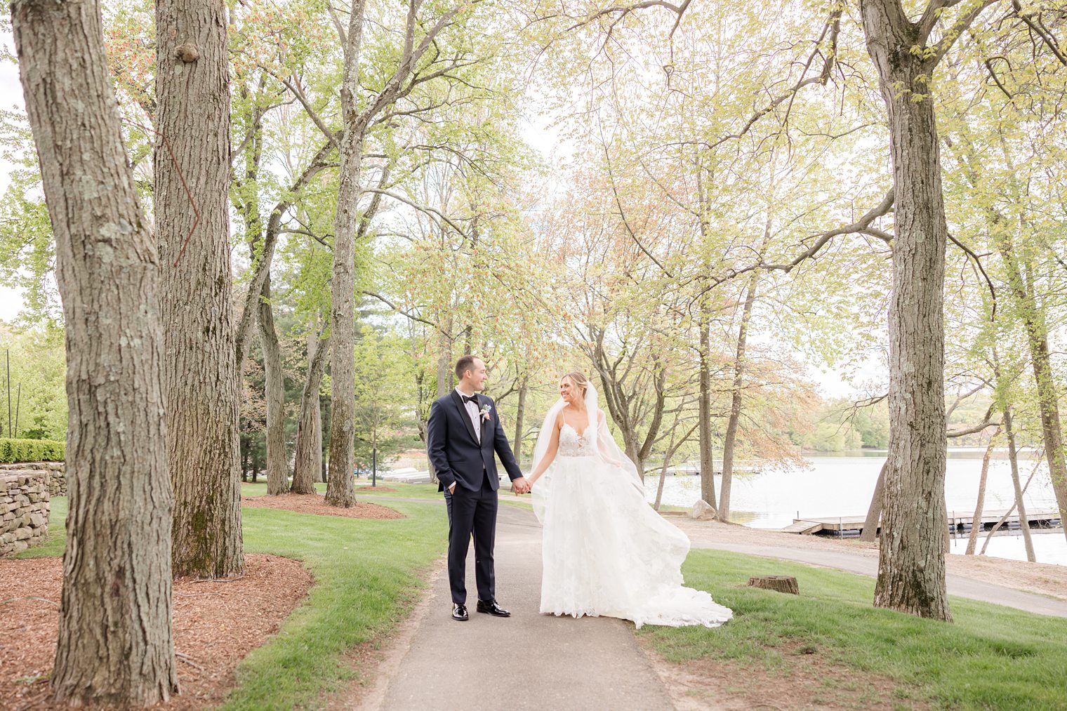 Happy couple enjoying their walk together before say "I do" at Indian Trail Club