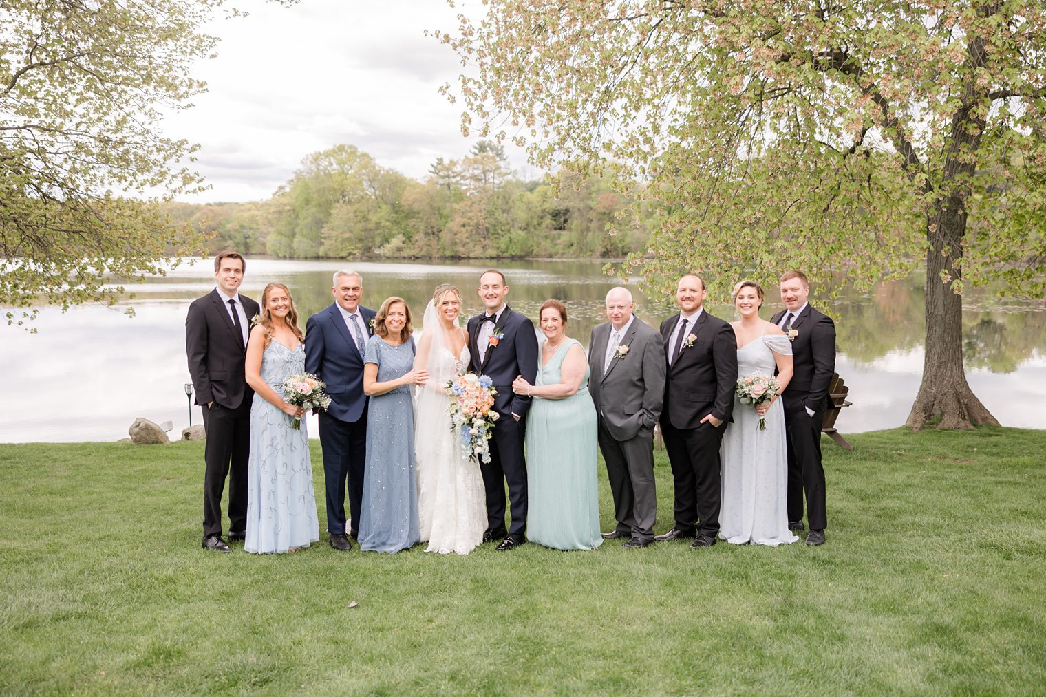 Groom and Bride with their family's together at Indian Trail Club 