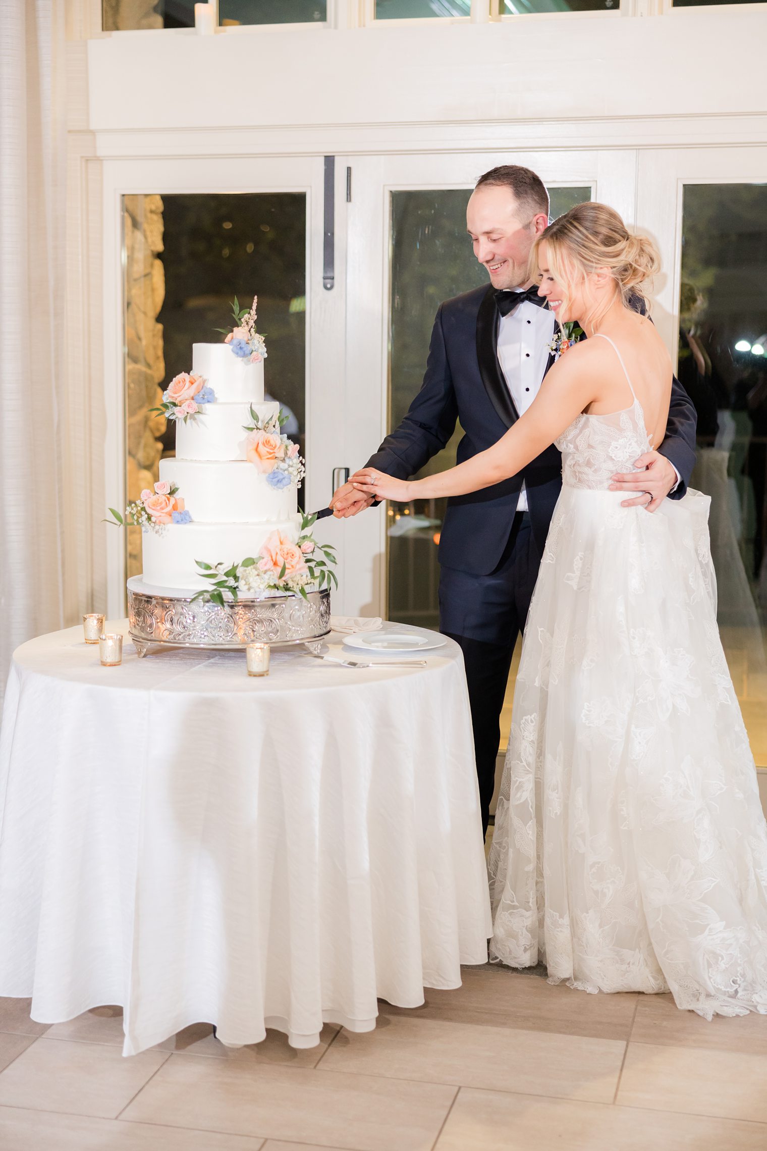 Husband and Wife cutting their wedding cake at Indian Trail Club