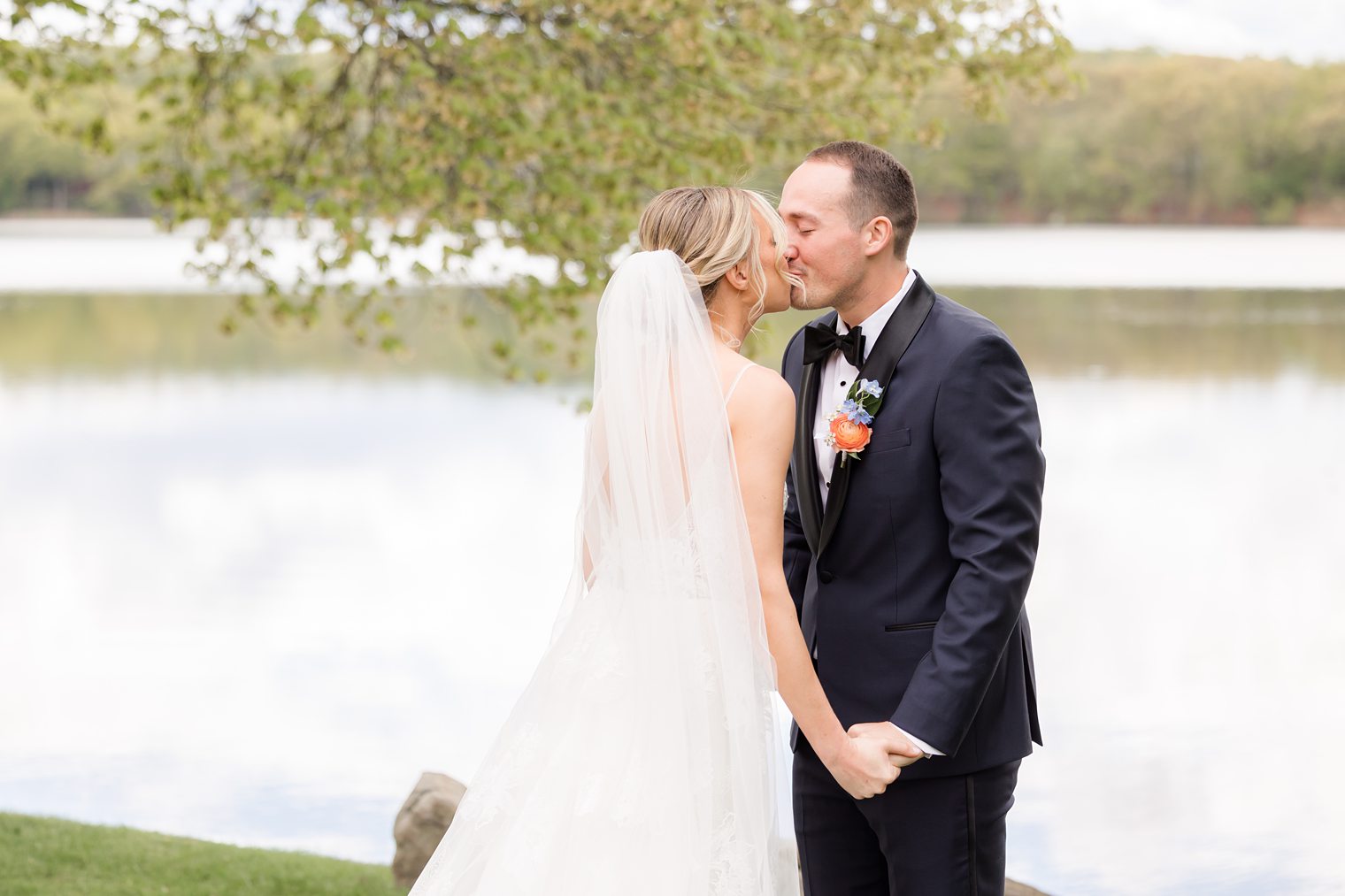 happy couple sharing a first kiss after a first look