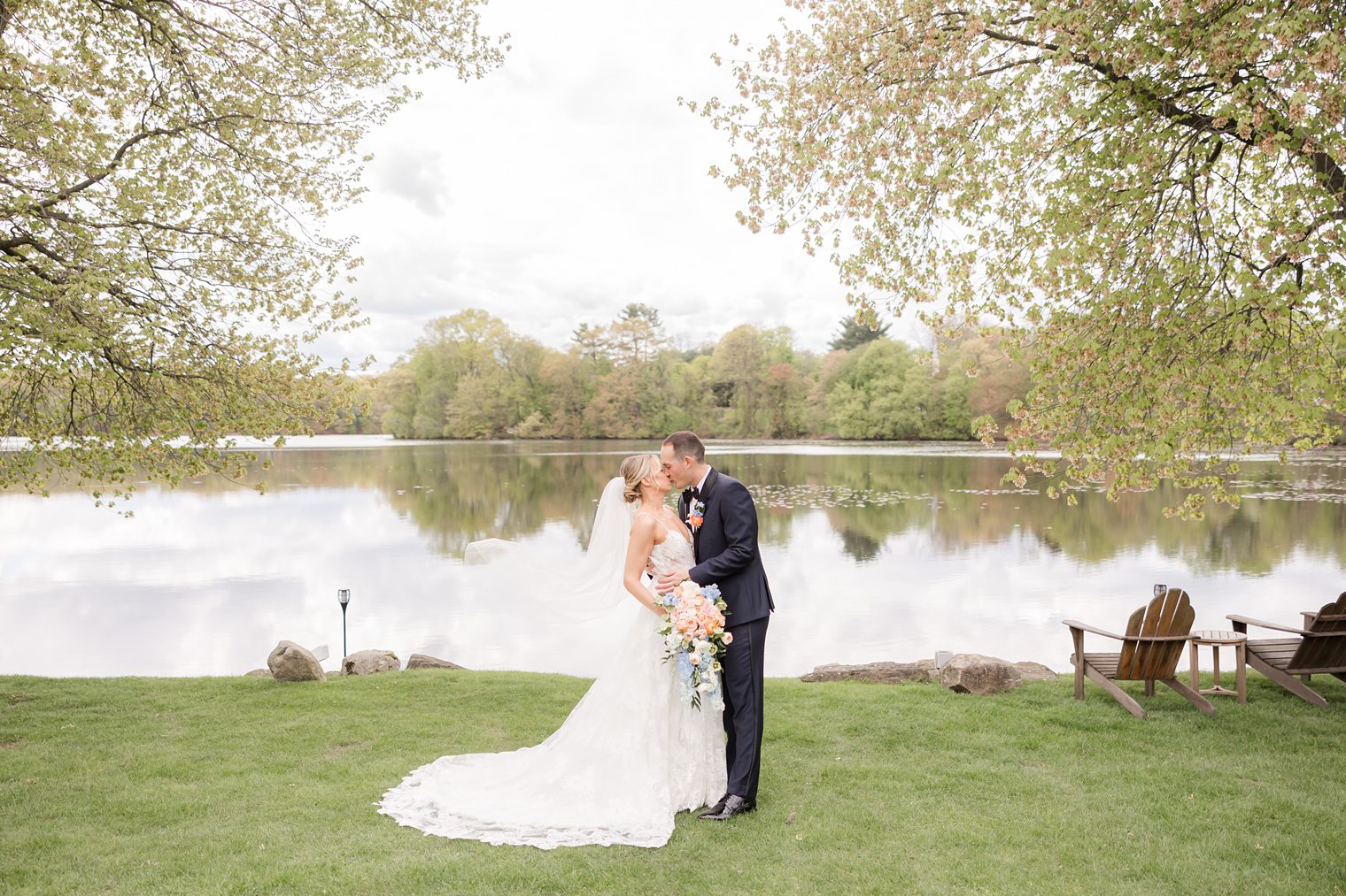 Bride and groom kissing after sharing their first look