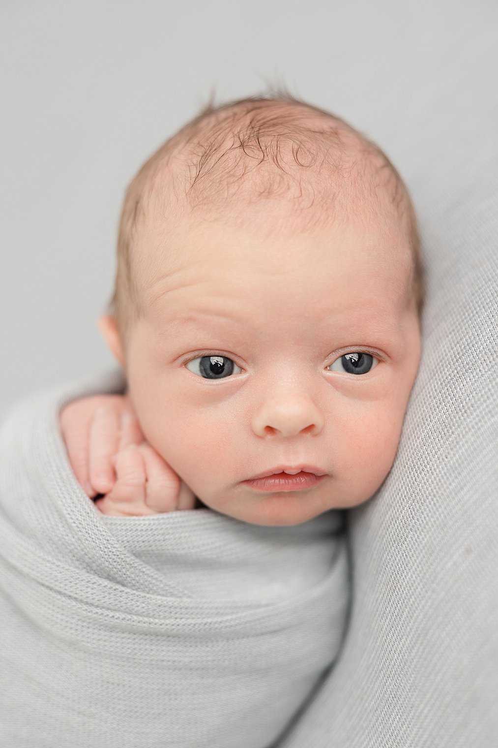 newborn boy with eyes open