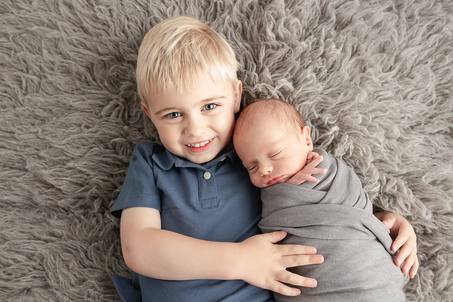 older brother with his newborn brother 