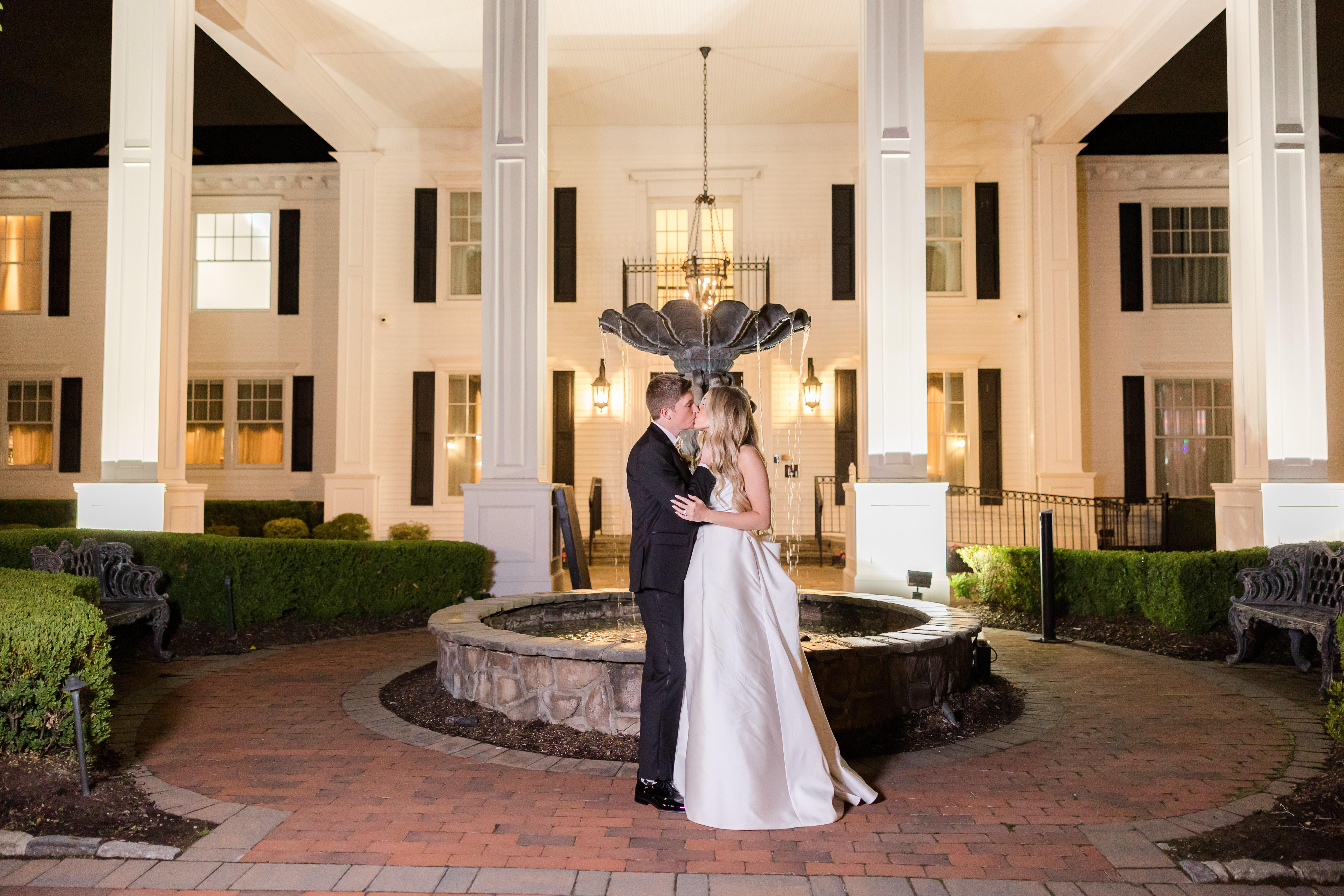 Married couple sharing a kiss at the end of the evening 